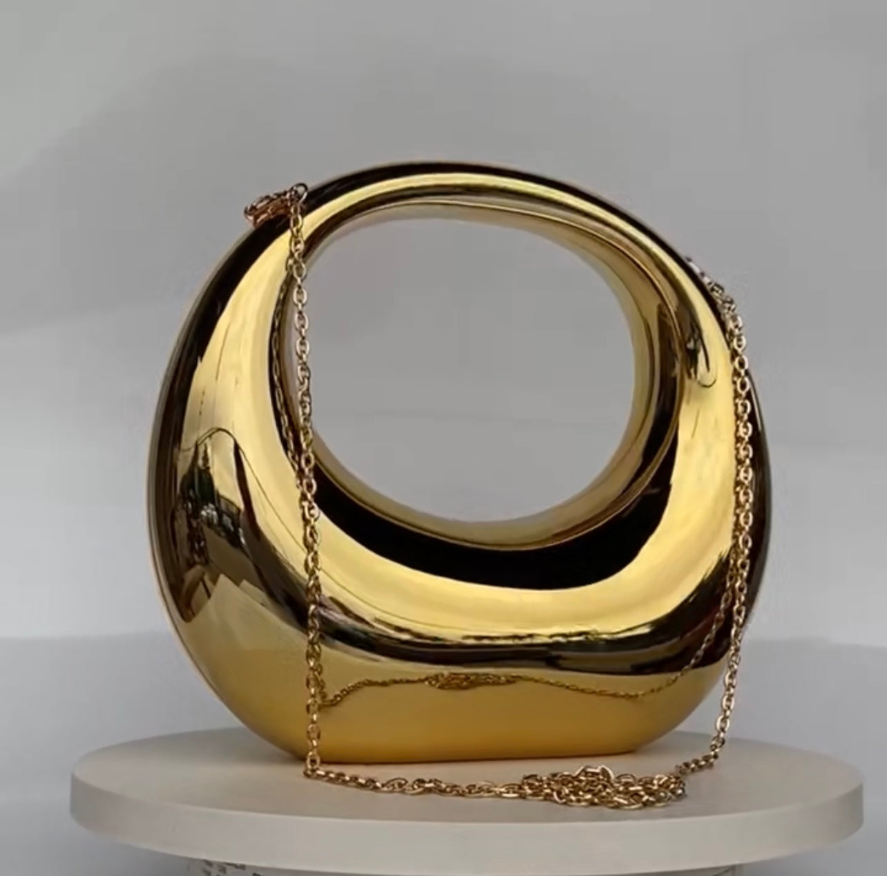 Sculptural Elegance Gold Clutch